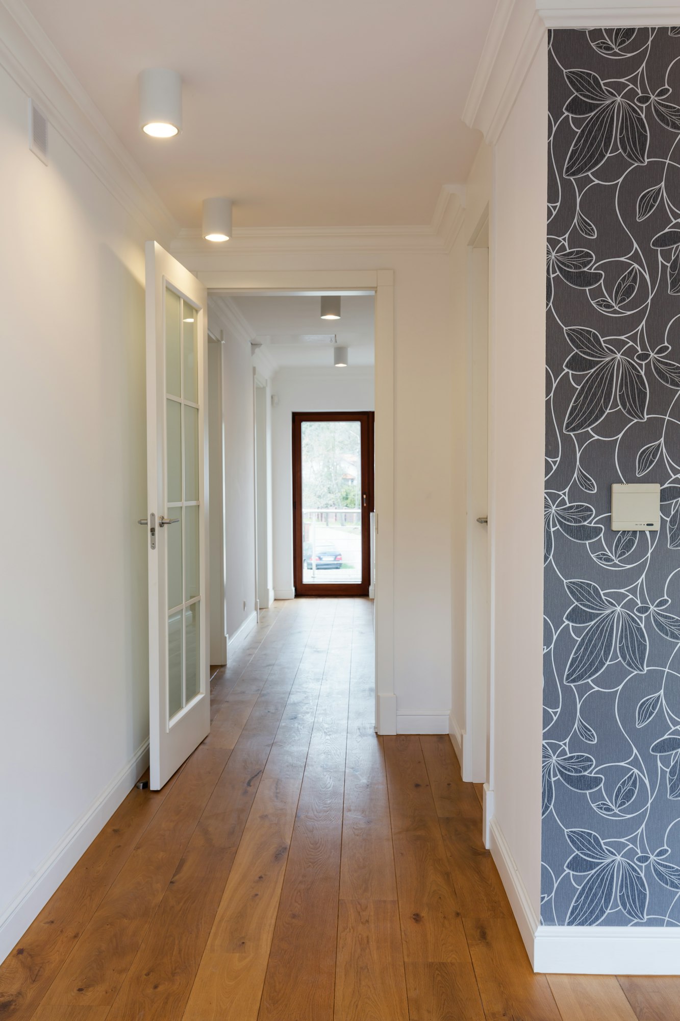 Bright hallway with wooden flooring