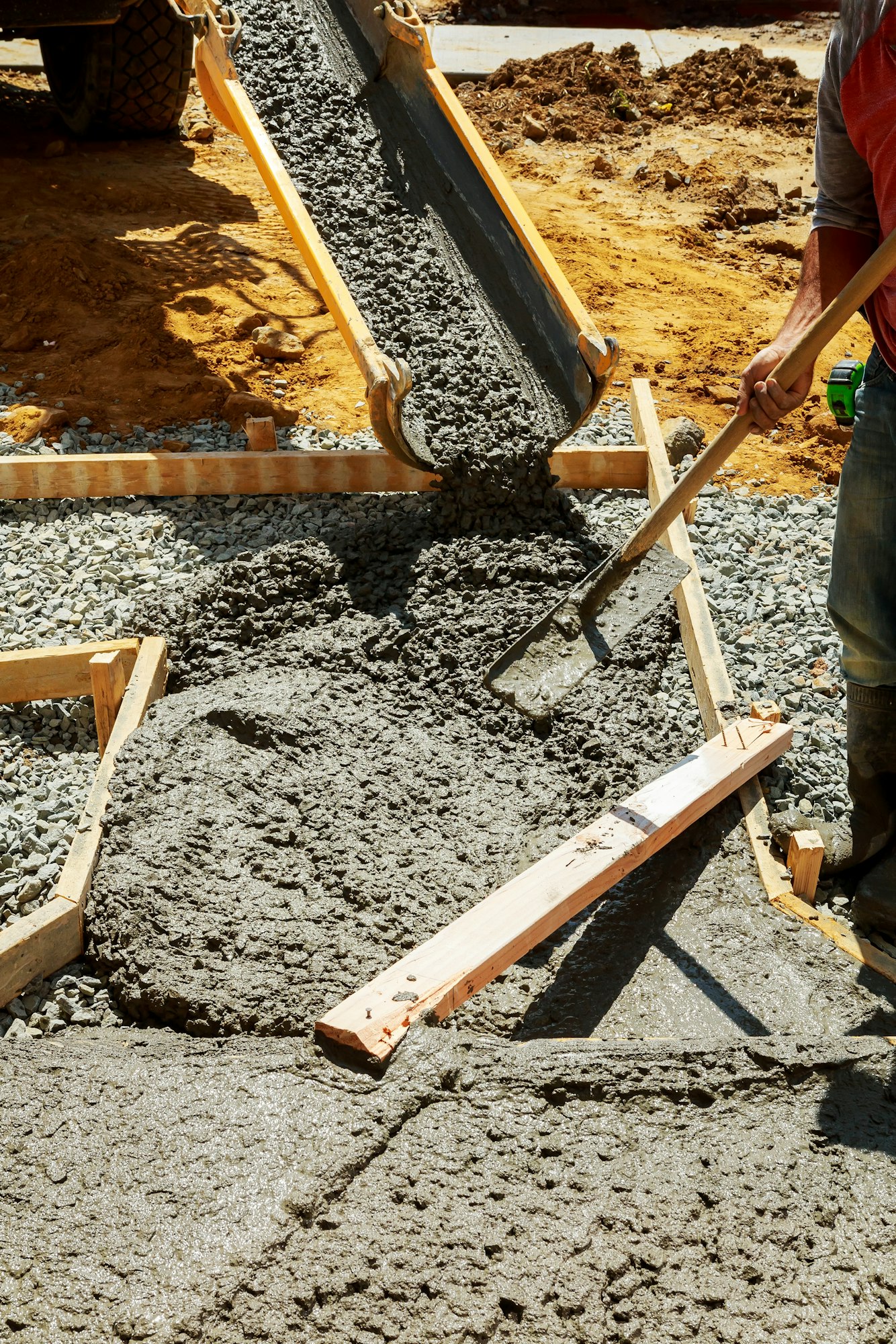 Pouring cement during Upgrade to residential street paving concrete pavement near the house